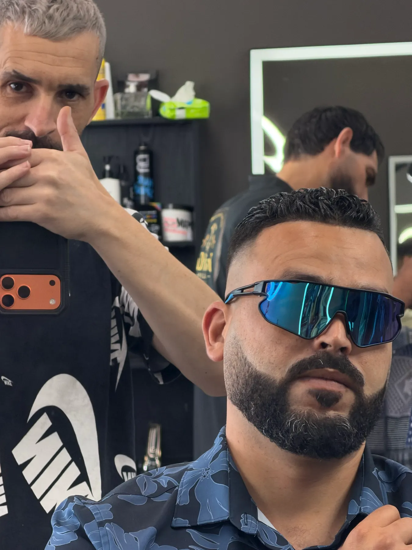 A barber working a line-up at Fresh Cut Salon